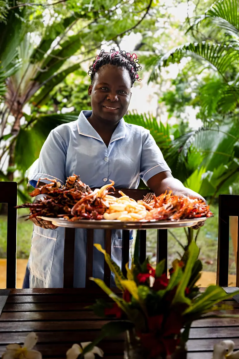 A platter of the morning catch — prawns, calamari and lobster — served in the garden