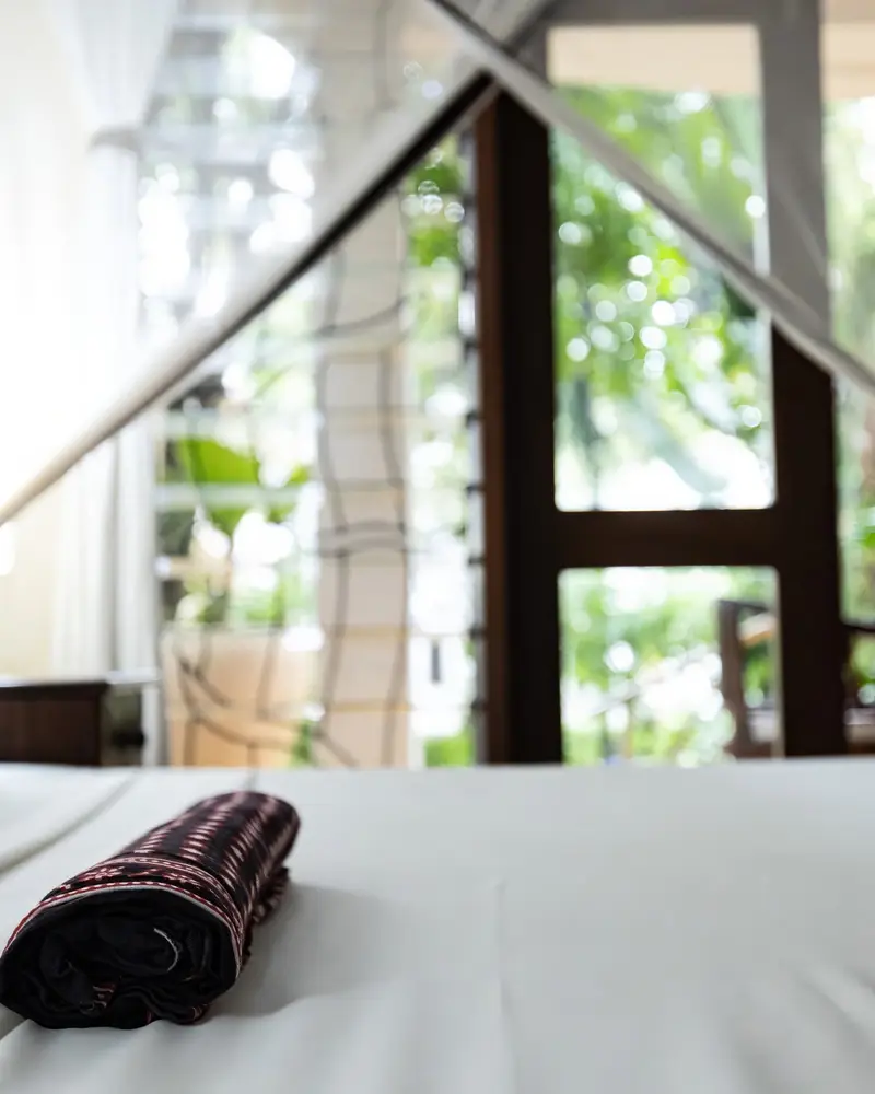 Master bedroom with a king Swahili bed under a mosquito canopy
