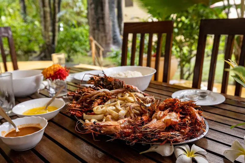 A seafood platter of prawns, calamari and lobster on the verandah table